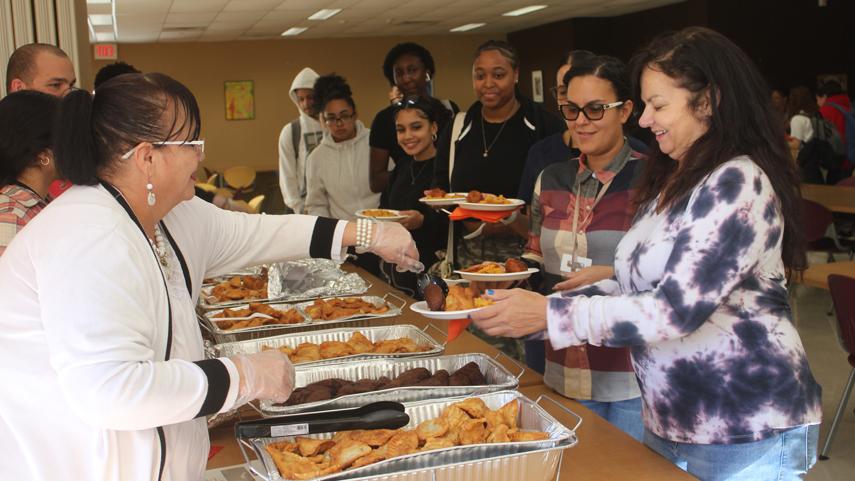 attendees getting food at Hispanic Heritage Month Celebration & Latin Food Tasting